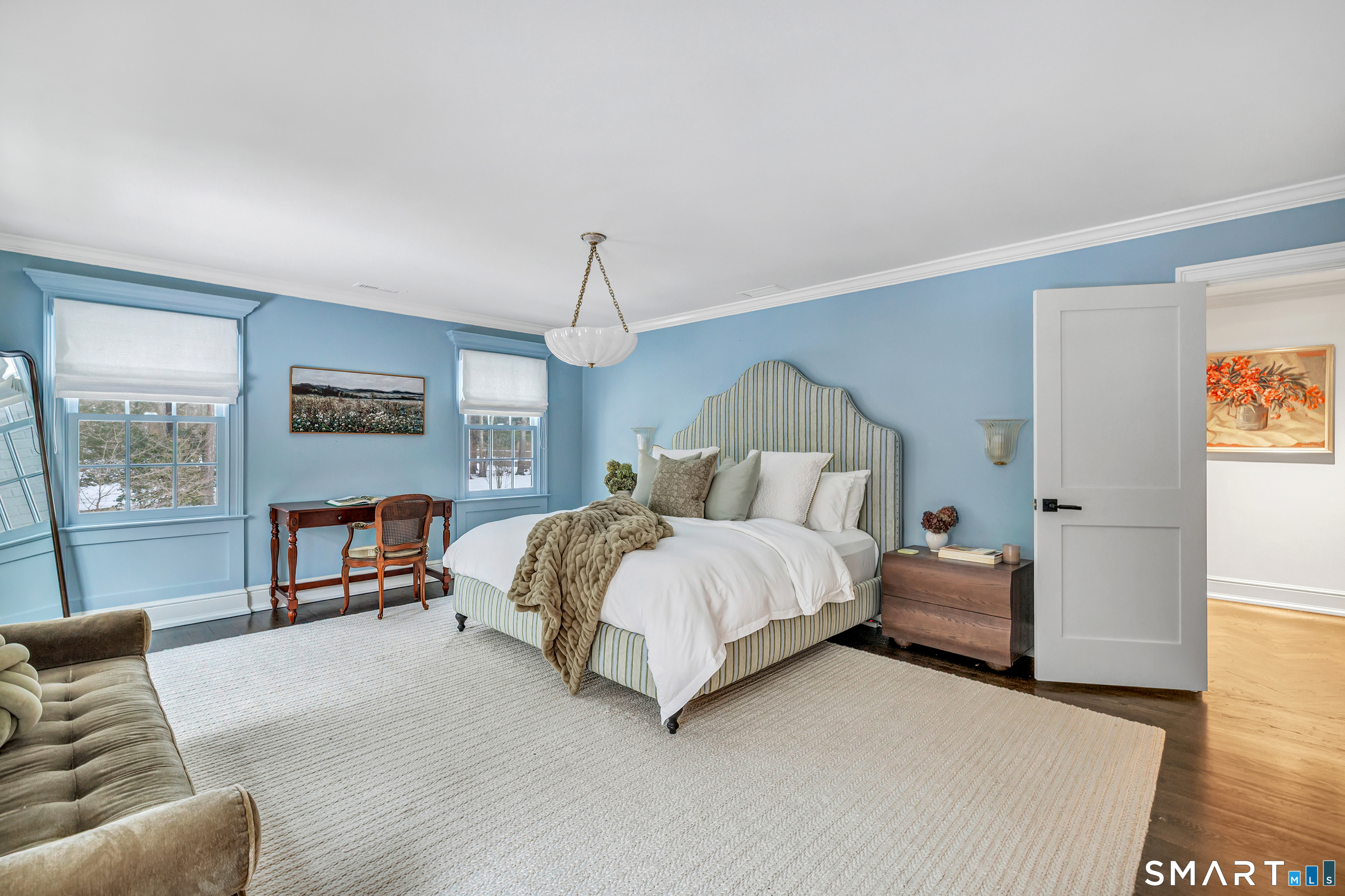 200 Longmeadow Road Fairfield, CT 06824 - Photo 23 of 40 a spacious bedroom with a bed and a couch