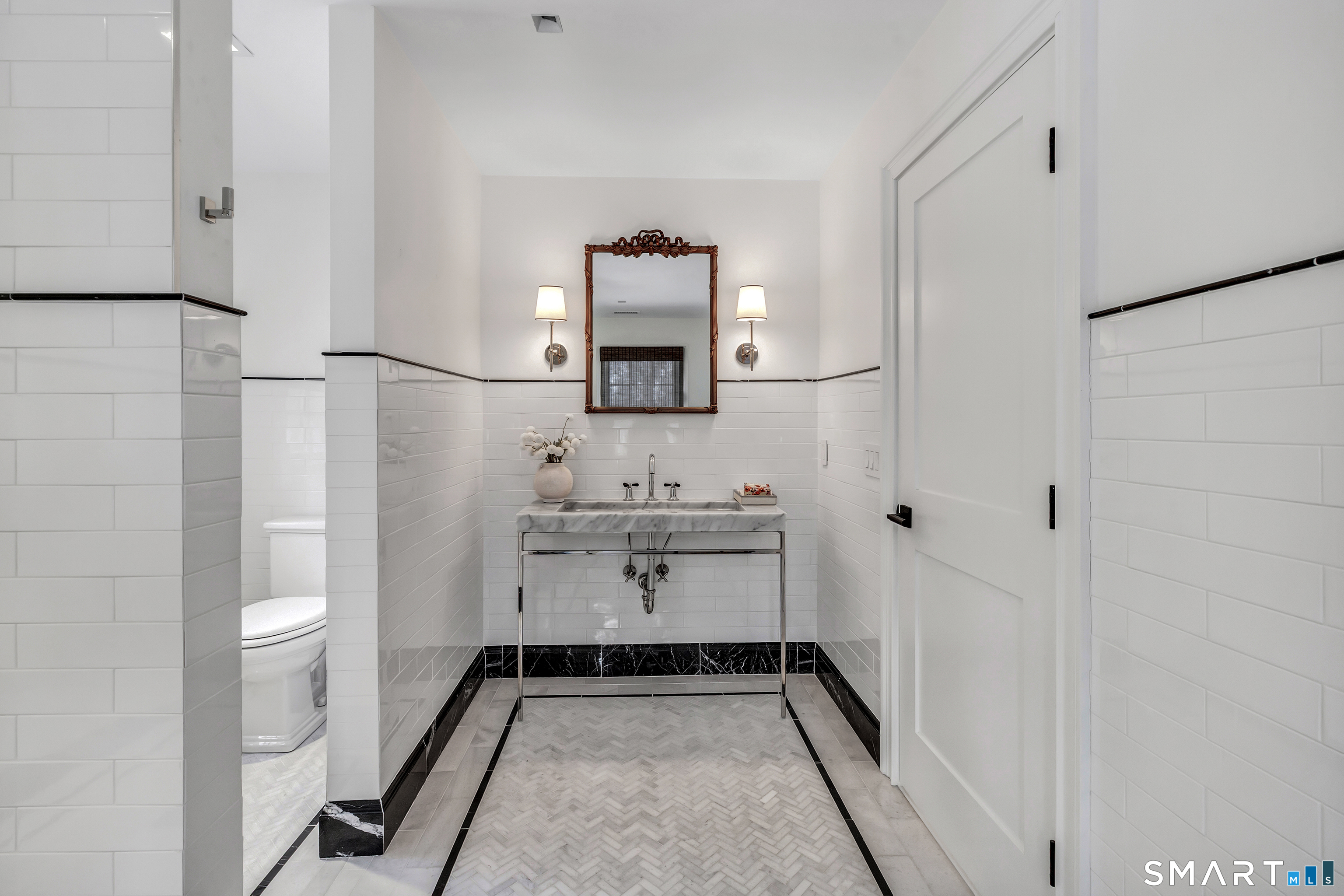 200 Longmeadow Road Fairfield, CT 06824 - Photo 31 of 40 a bathroom with a sink and a mirror