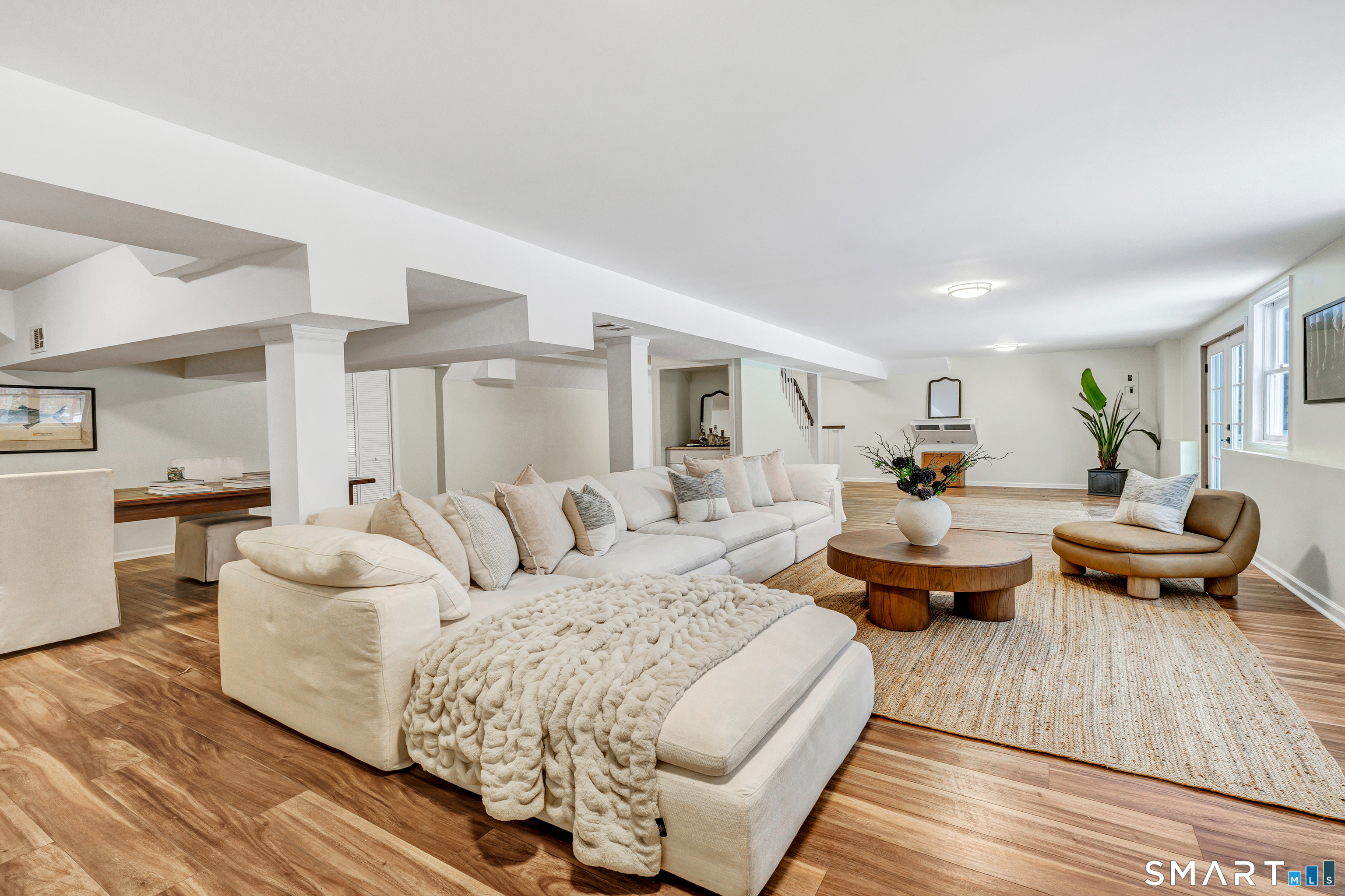 200 Longmeadow Road Fairfield, CT 06824 - Photo 35 of 40 a living room with furniture and a wooden floor
