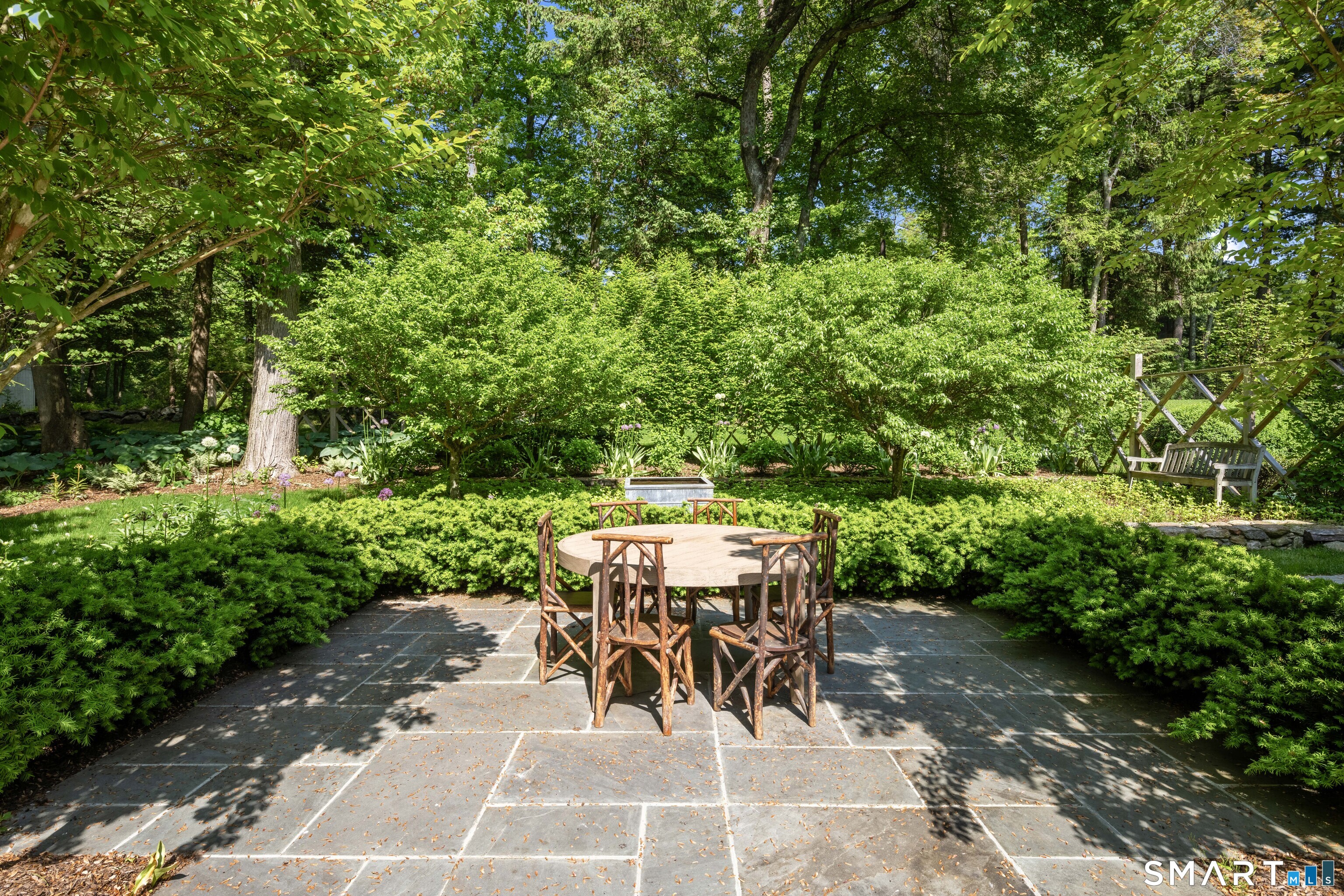 200 Longmeadow Road Fairfield, CT 06824 - Photo 37 of 40 a view of a patio with table and chairs and potted plants