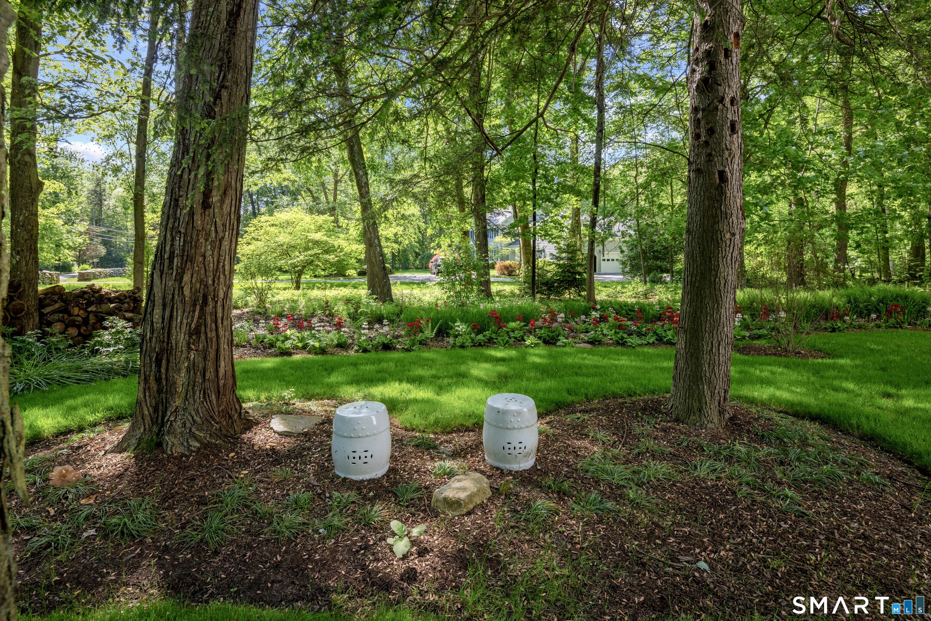 200 Longmeadow Road Fairfield, CT 06824 - Photo 38 of 40 a view of a chair and table in the garden