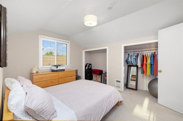 a bedroom with a bed and a closet