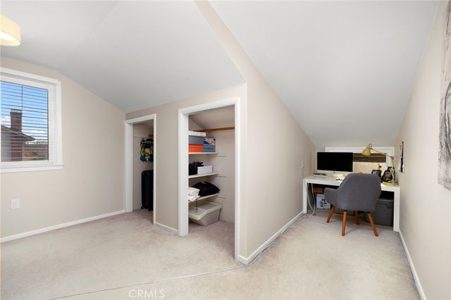 a workspace with furniture and a window