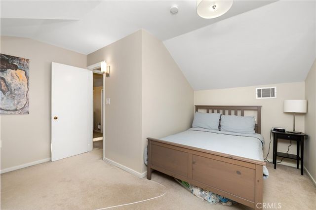 a room with a bed and a chair