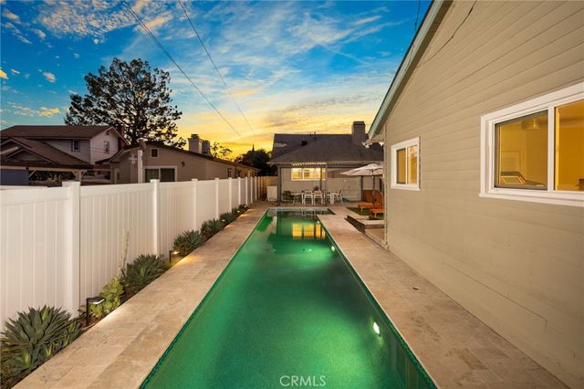 a view of a backyard with potted plants
