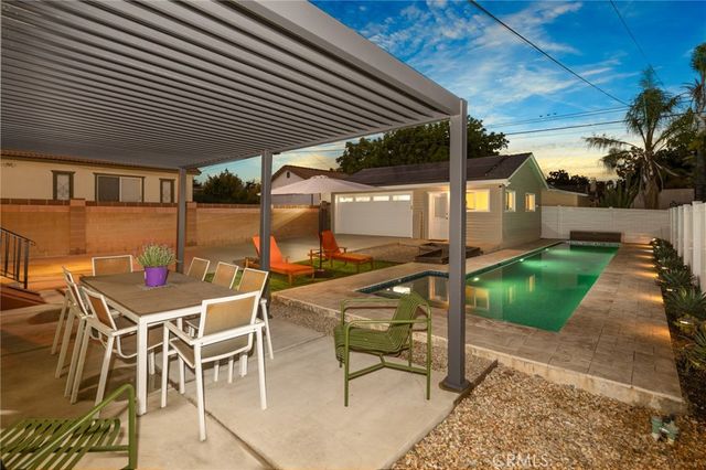 a patio with table and chairs