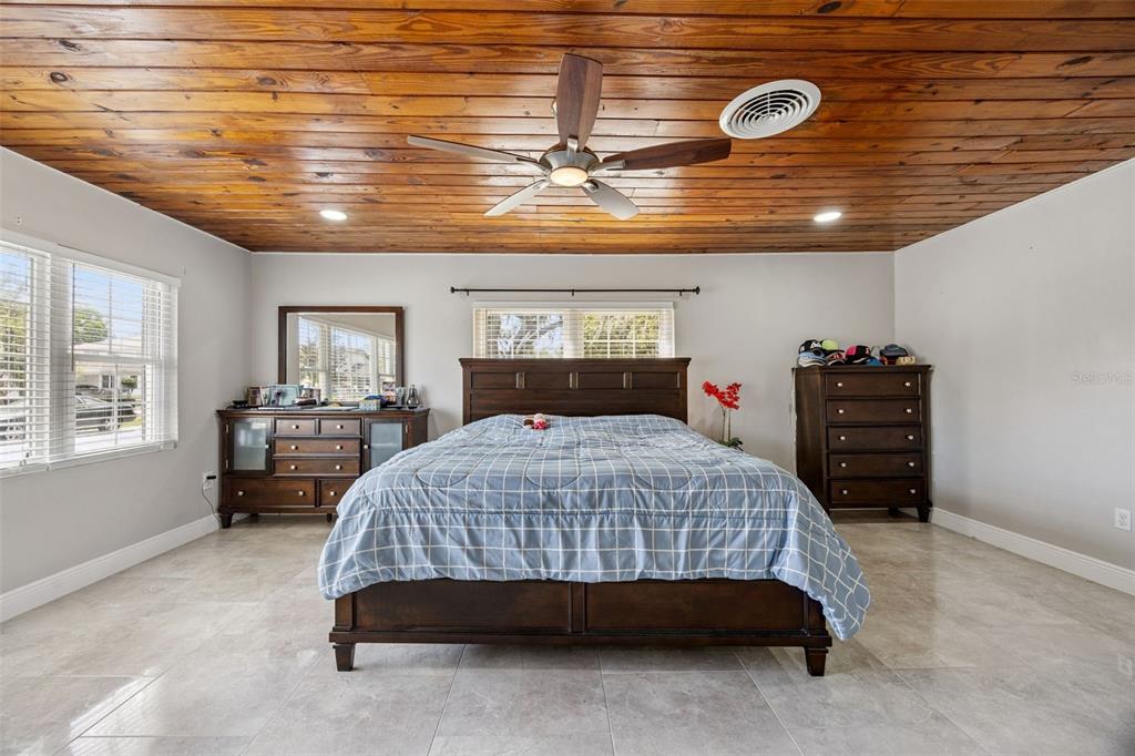 700 9th Street St. Cloud, FL 34769 - Photo 23 of 78 a bedroom with a large bed and a window