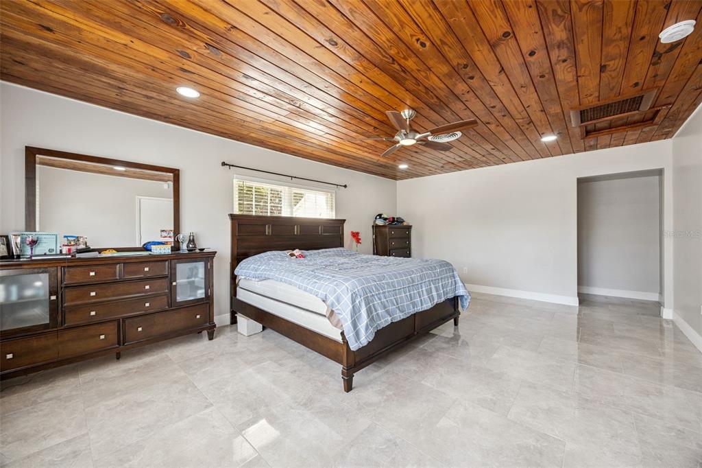 700 9th Street St. Cloud, FL 34769 - Photo 25 of 78 a bedroom with a bed and a dresser