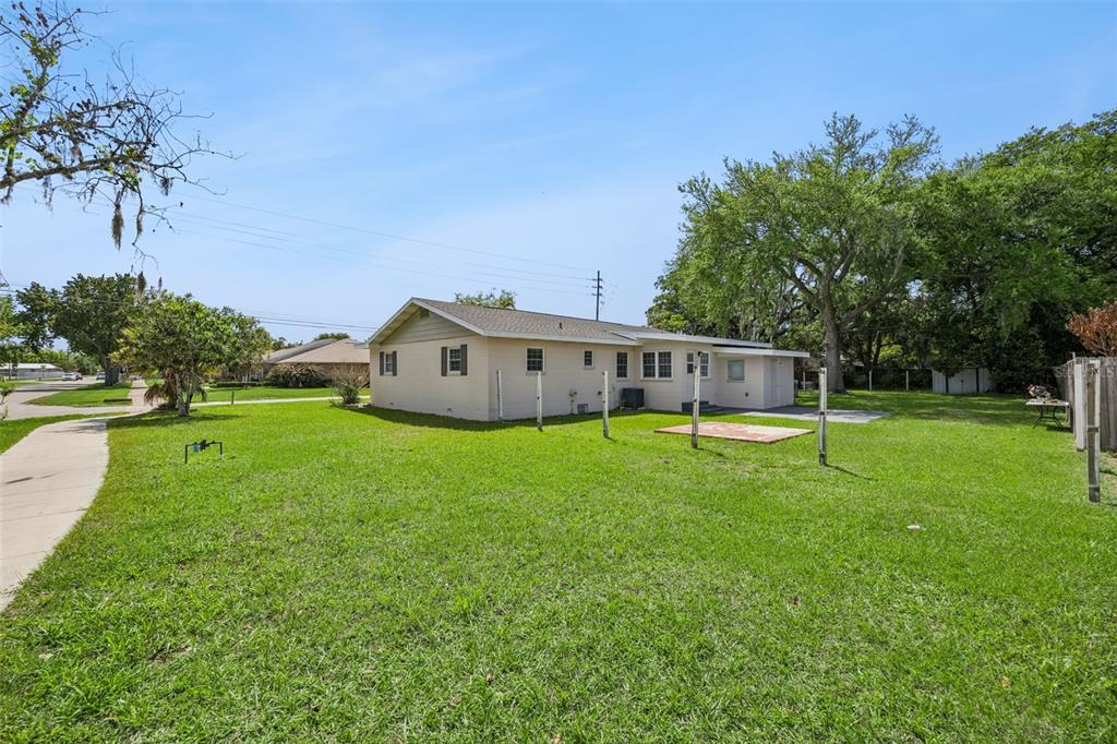 700 9th Street St. Cloud, FL 34769 - Photo 39 of 78 a view of a house with a backyard