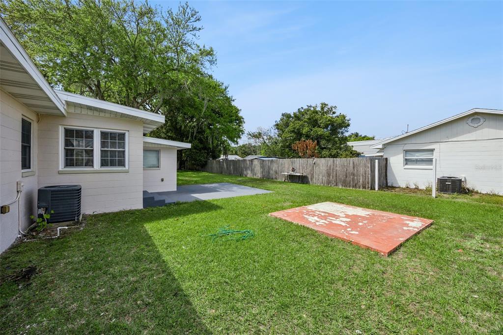 700 9th Street St. Cloud, FL 34769 - Photo 41 of 78 a view of backyard with seating area and green space