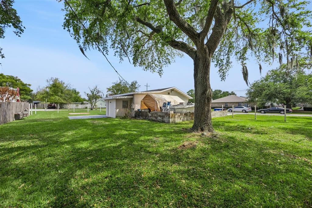 700 9th Street St. Cloud, FL 34769 - Photo 48 of 78 a backyard of a house with lots of green space