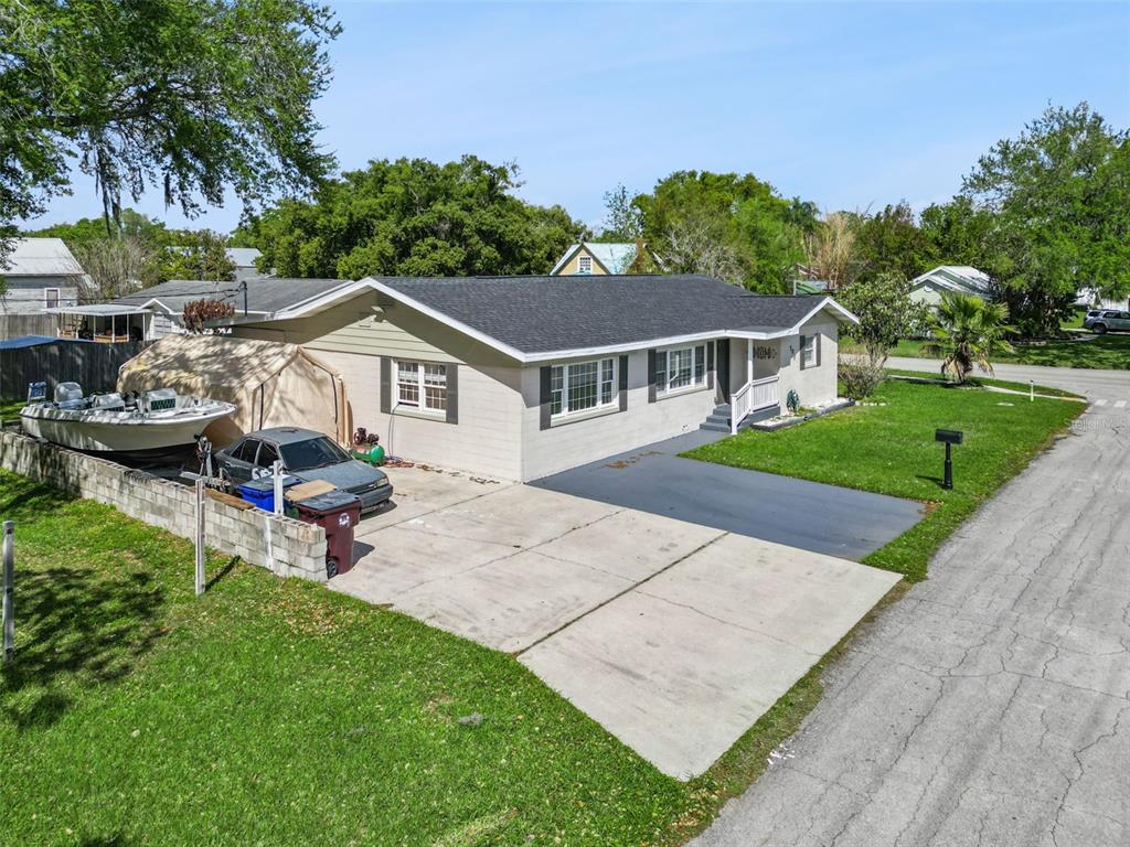 700 9th Street St. Cloud, FL 34769 - Photo 56 of 78 a aerial view of a house with a garden and plants