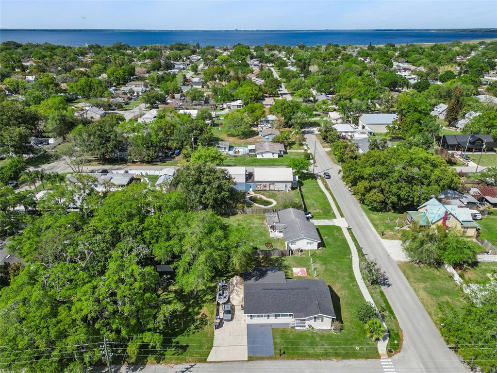 700 9th Street St. Cloud, FL 34769 - Photo 60 of 78 an aerial view of residential houses with outdoor space and street view