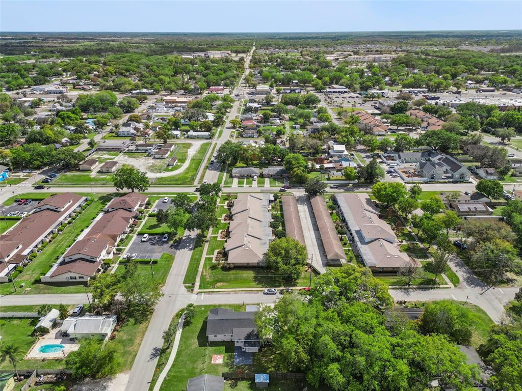 700 9th Street St. Cloud, FL 34769 - Photo 64 of 78 an aerial view of residential houses with outdoor space and parking