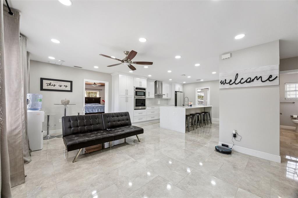 700 9th Street St. Cloud, FL 34769 - Photo 7 of 78 a living room with furniture and kitchen view