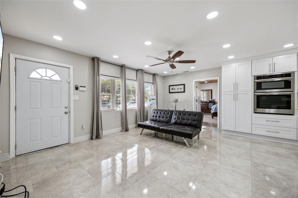 700 9th Street St. Cloud, FL 34769 - Photo 10 of 78 a living room with furniture and a flat screen tv