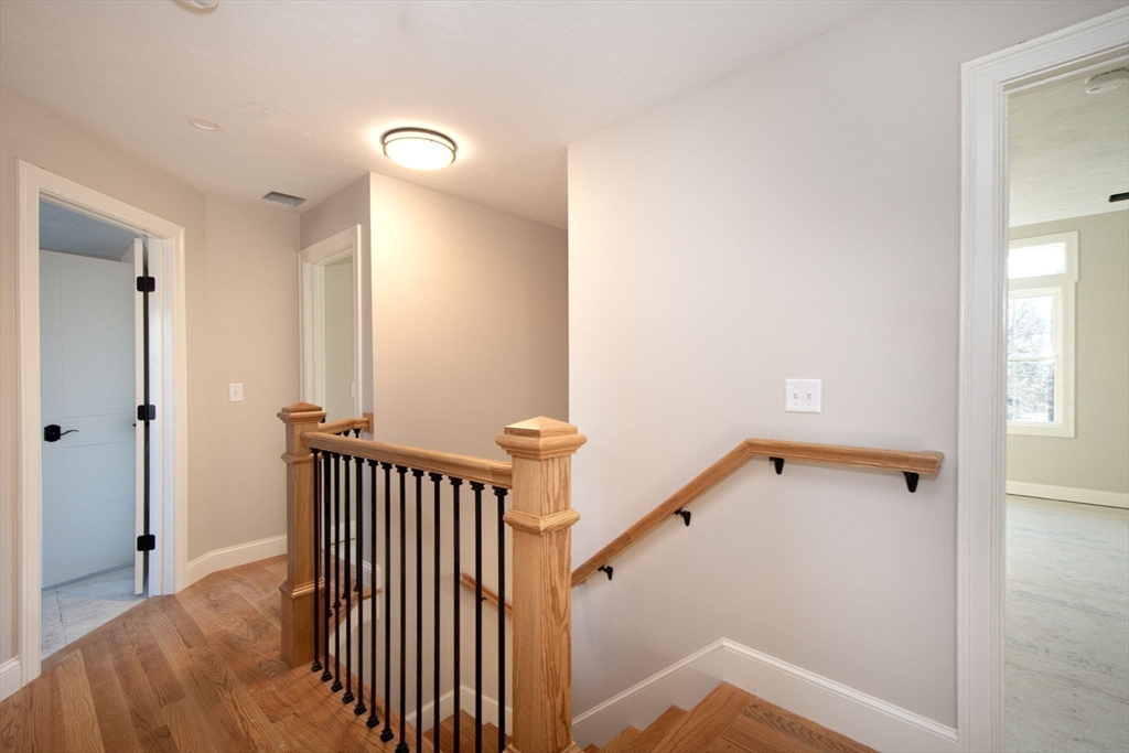 548 Harvard Street Whitman, MA 02382 - Photo 16 of 37 a view of a hallway with a door and stairs