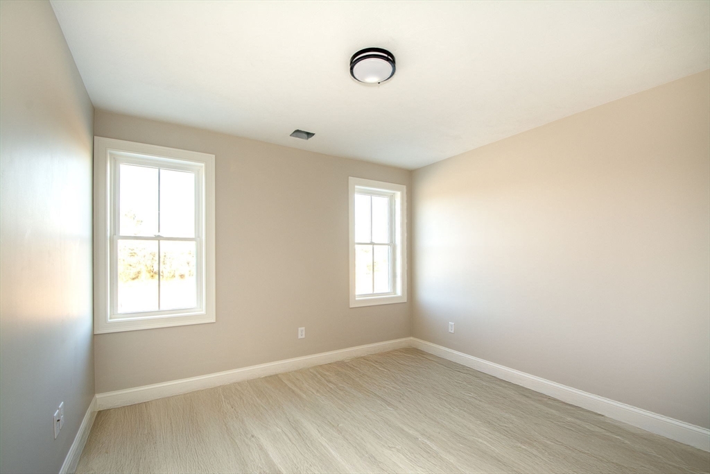 548 Harvard Street Whitman, MA 02382 - Photo 23 of 37 an empty room with windows