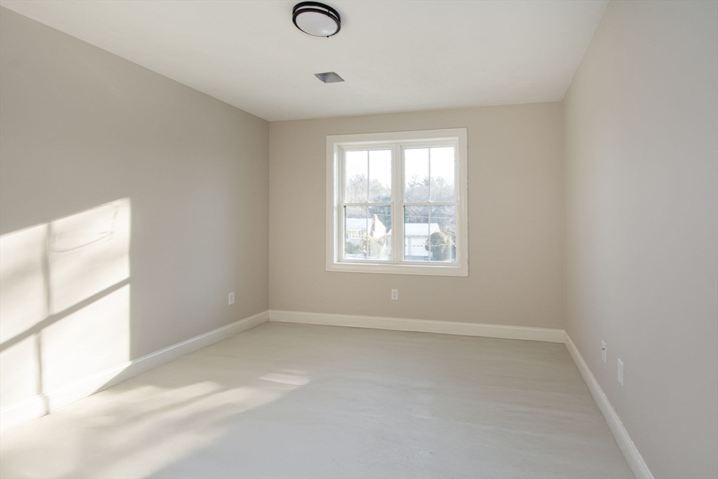 548 Harvard Street Whitman, MA 02382 - Photo 25 of 37 an empty room with a window