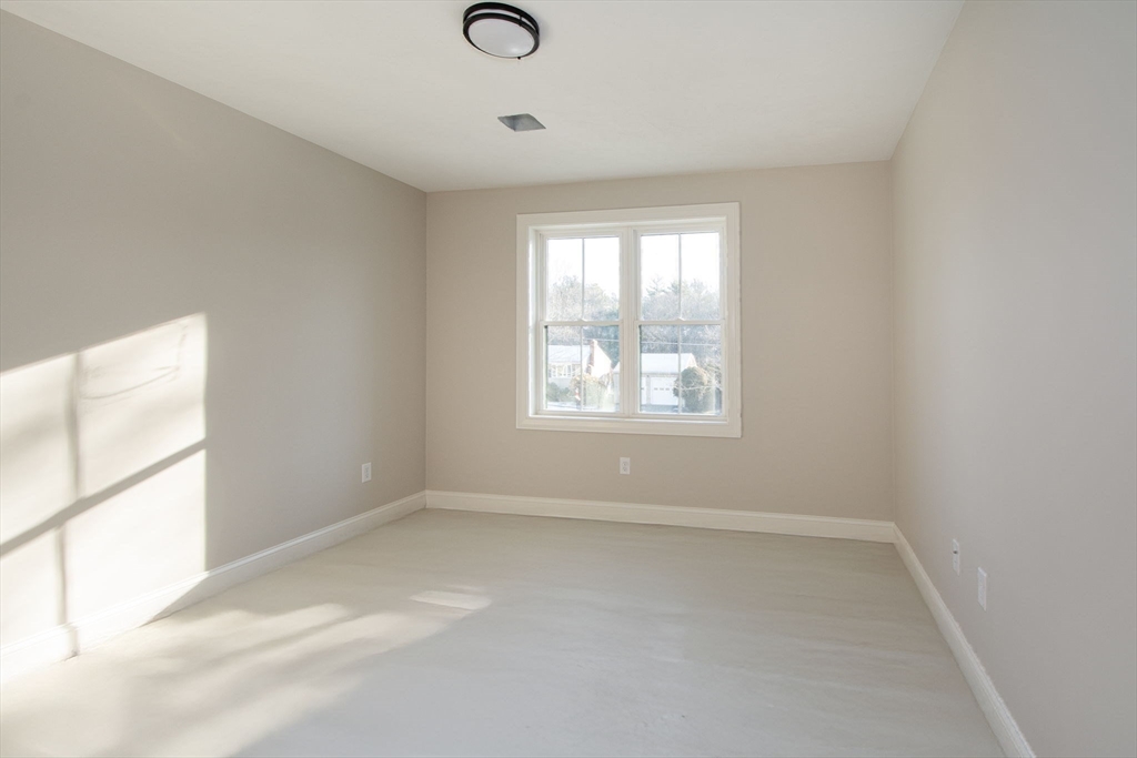 548 Harvard Street Whitman, MA 02382 - Photo 28 of 37 an empty room with a window