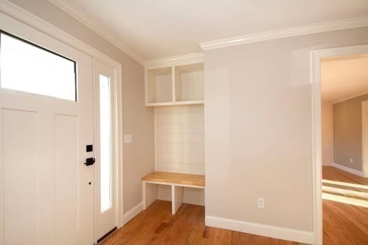 548 Harvard Street Whitman, MA 02382 - Photo 3 of 37 a view of an empty room with wooden floor and a window
