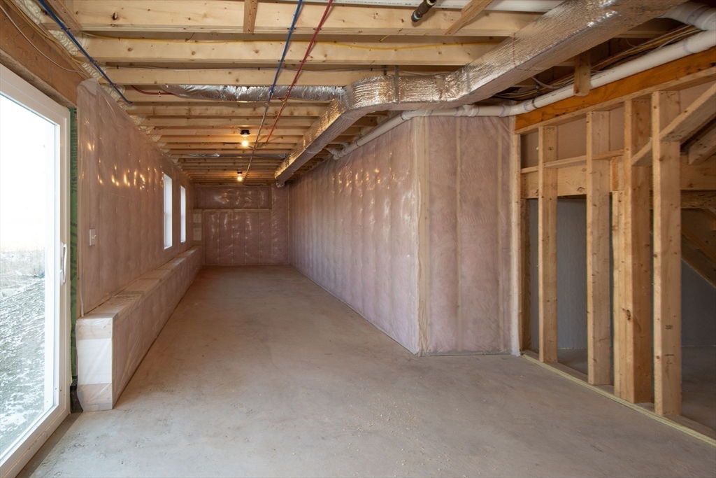 548 Harvard Street Whitman, MA 02382 - Photo 34 of 37 a view of hallway with wooden walls