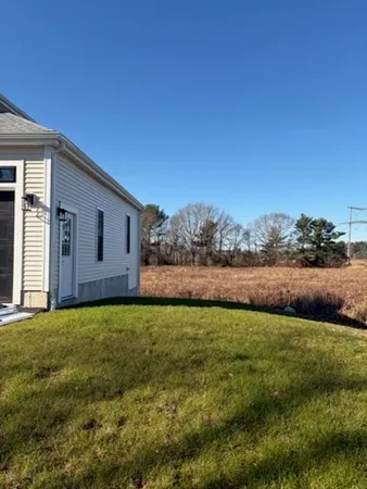 a view of a patio with a big yard
