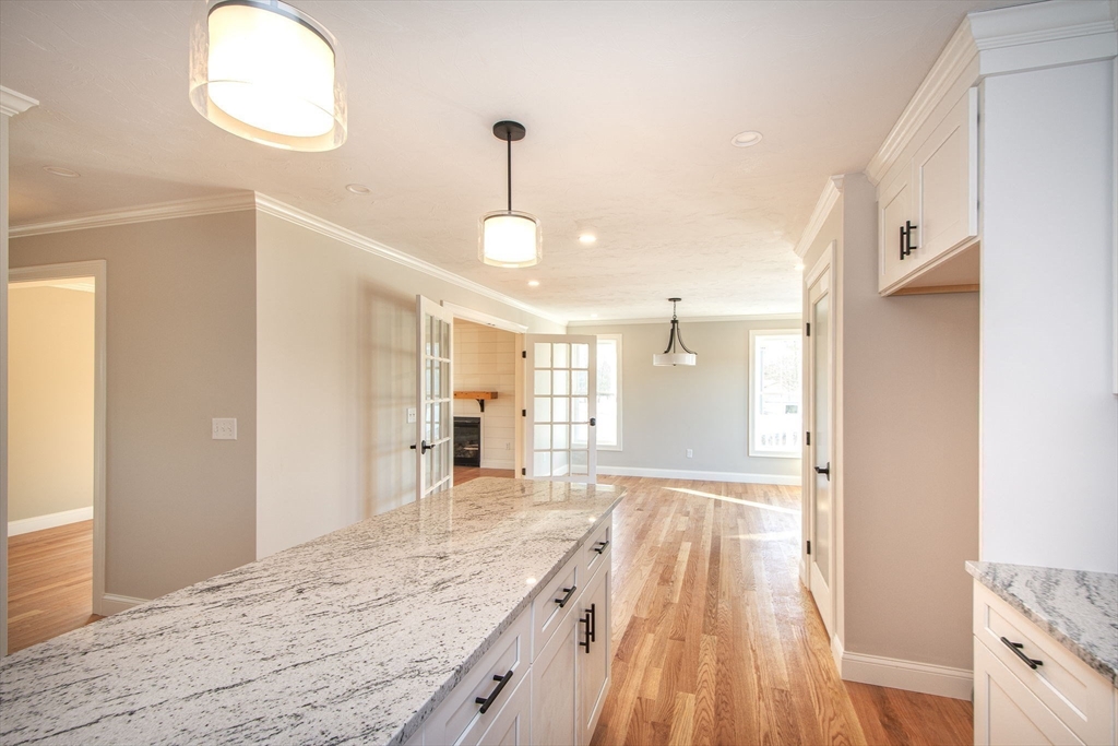 548 Harvard Street Whitman, MA 02382 - Photo 5 of 37 a spacious bathroom with a granite countertop sink a toilet and a shower