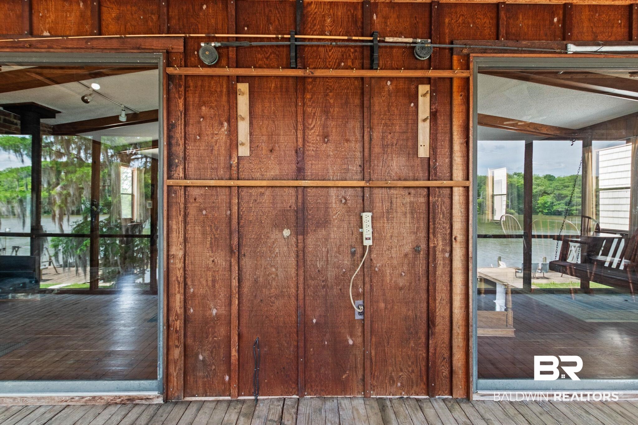 8153 Bryant's Lndg Road Stockton, AL 36579 - Photo 62 of 87 Wood-paneled exterior with exposed wood beams and glass panel doors