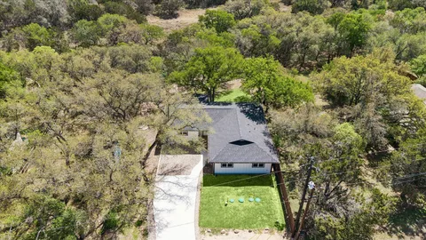 an aerial view of residential house with outdoor space