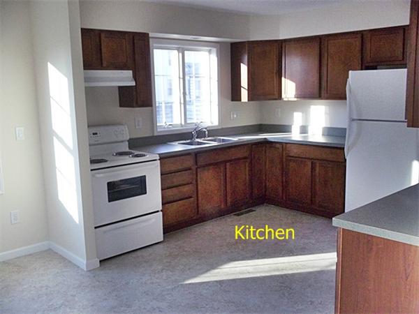193 Pendleton Avenue Springfield, MA 01109 - Photo 4 of 22 a kitchen with a cabinets and white appliances