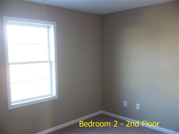 193 Pendleton Avenue Springfield, MA 01109 - Photo 10 of 22 a view of an empty room with a window