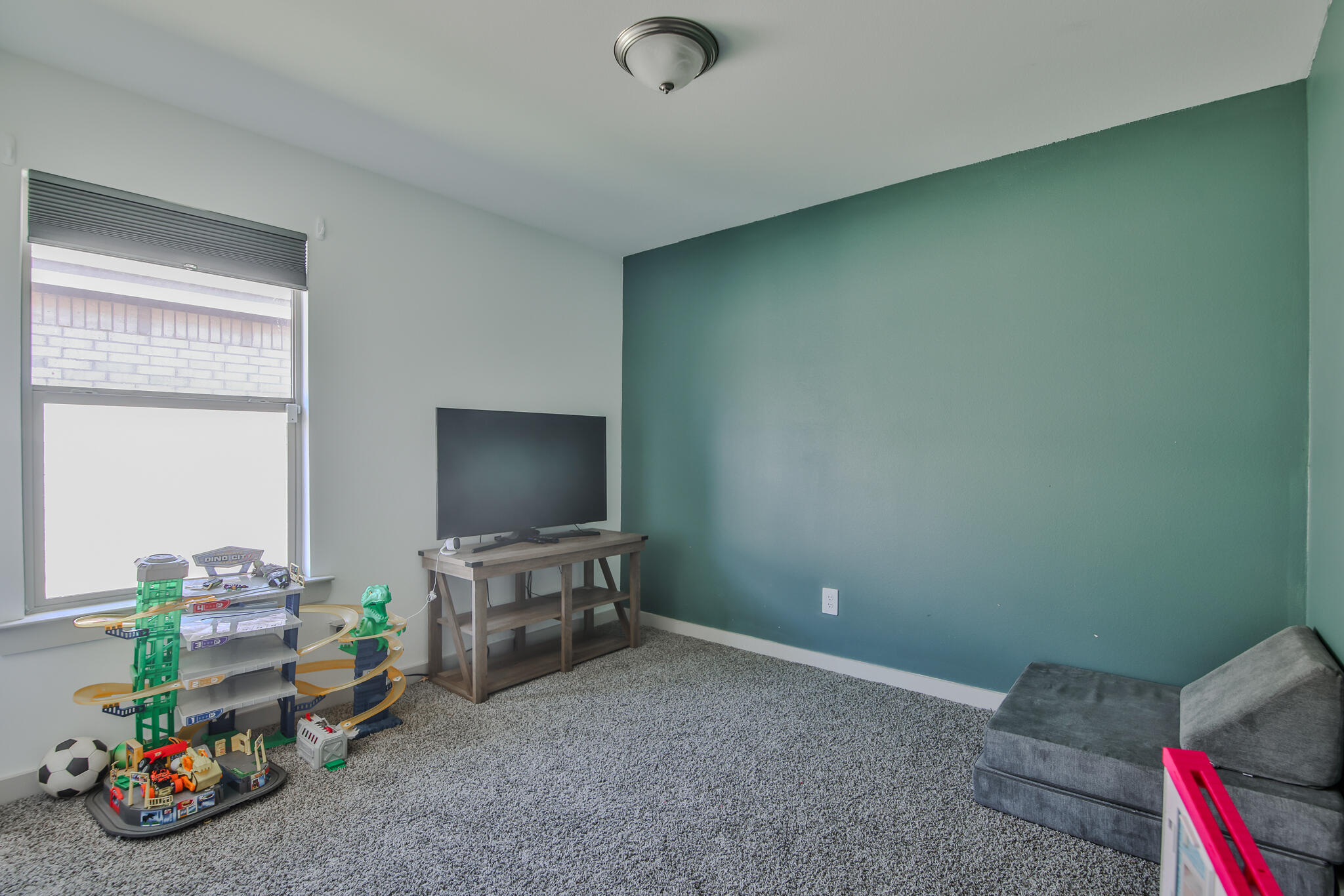 7406 9th Street Lubbock, TX 79416 - Photo 19 of 54 a view of a room with toys and toys