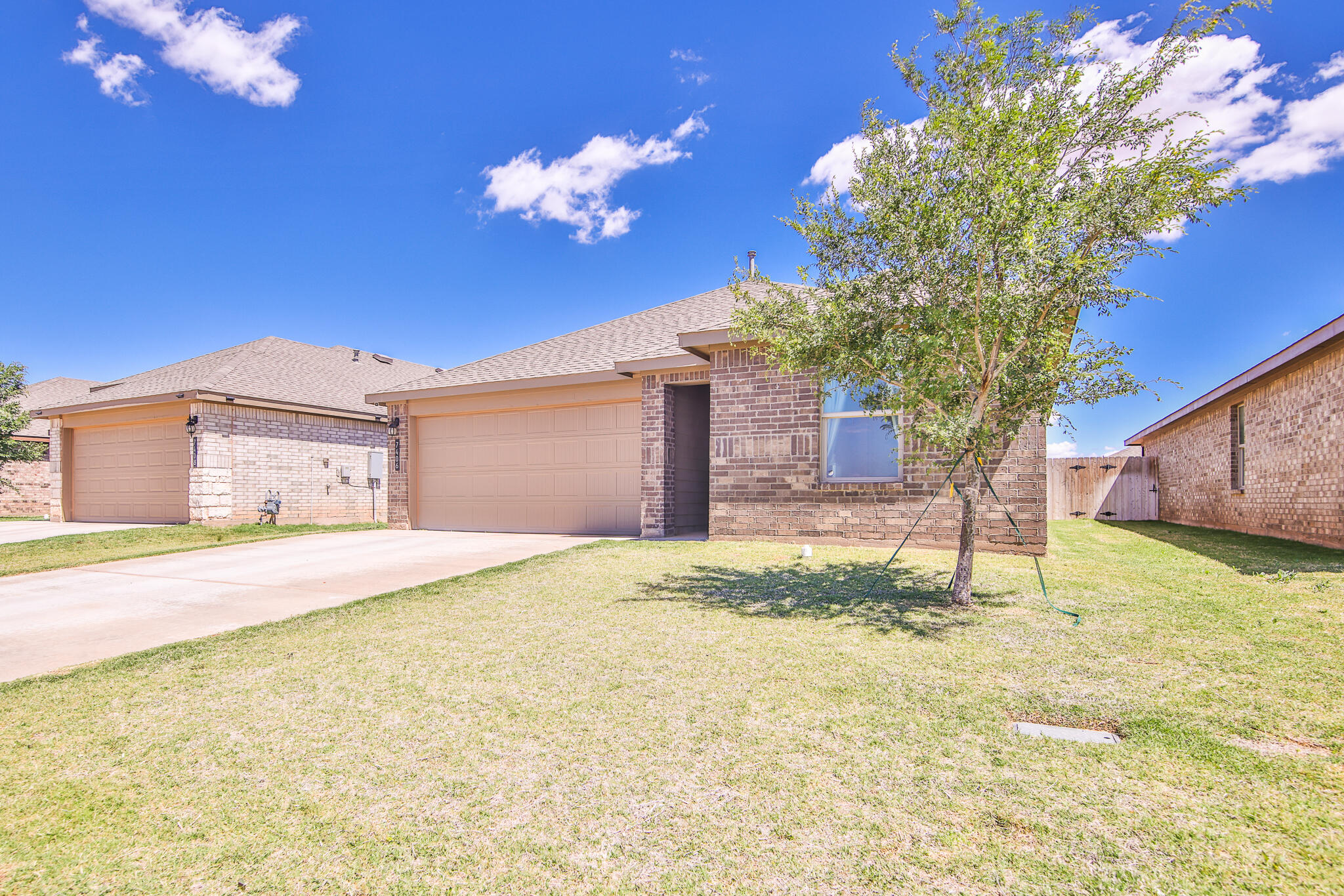 7406 9th Street Lubbock, TX 79416 - Photo 2 of 54 a house view with a outdoor space