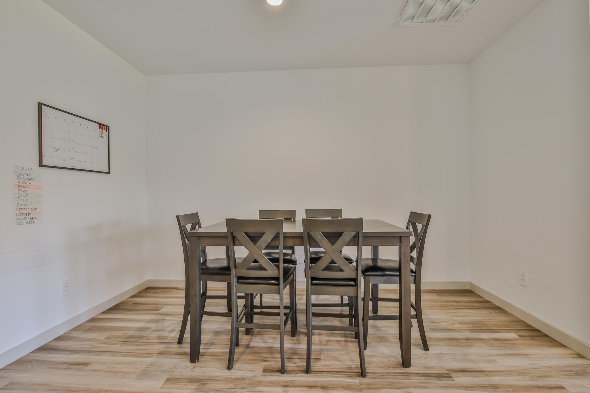 7406 9th Street Lubbock, TX 79416 - Photo 24 of 54 a view of a dining room with furniture and wooden floor