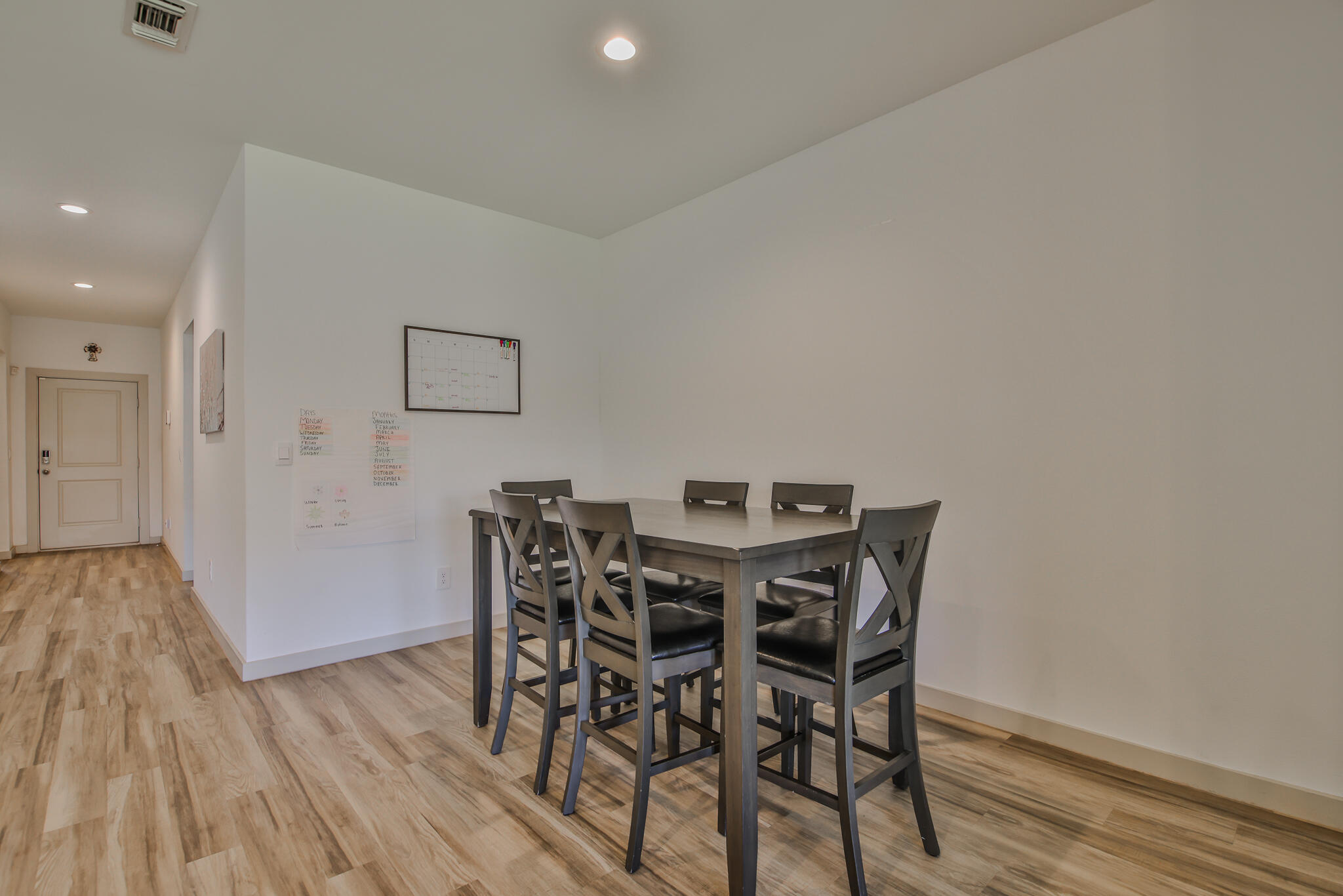 7406 9th Street Lubbock, TX 79416 - Photo 25 of 54 a view of a dining room with furniture and wooden floor
