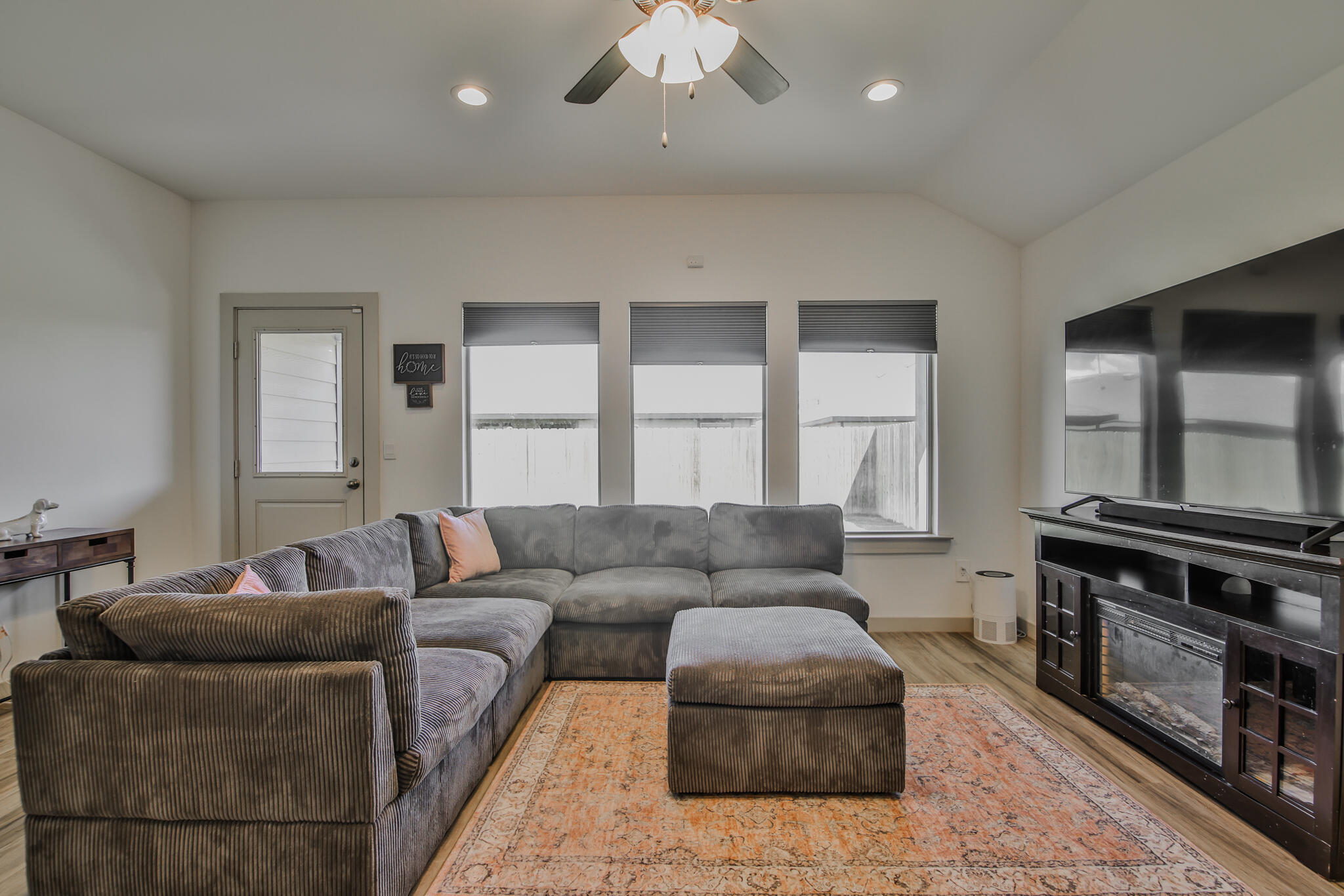 7406 9th Street Lubbock, TX 79416 - Photo 37 of 54 a living room with furniture and a fireplace