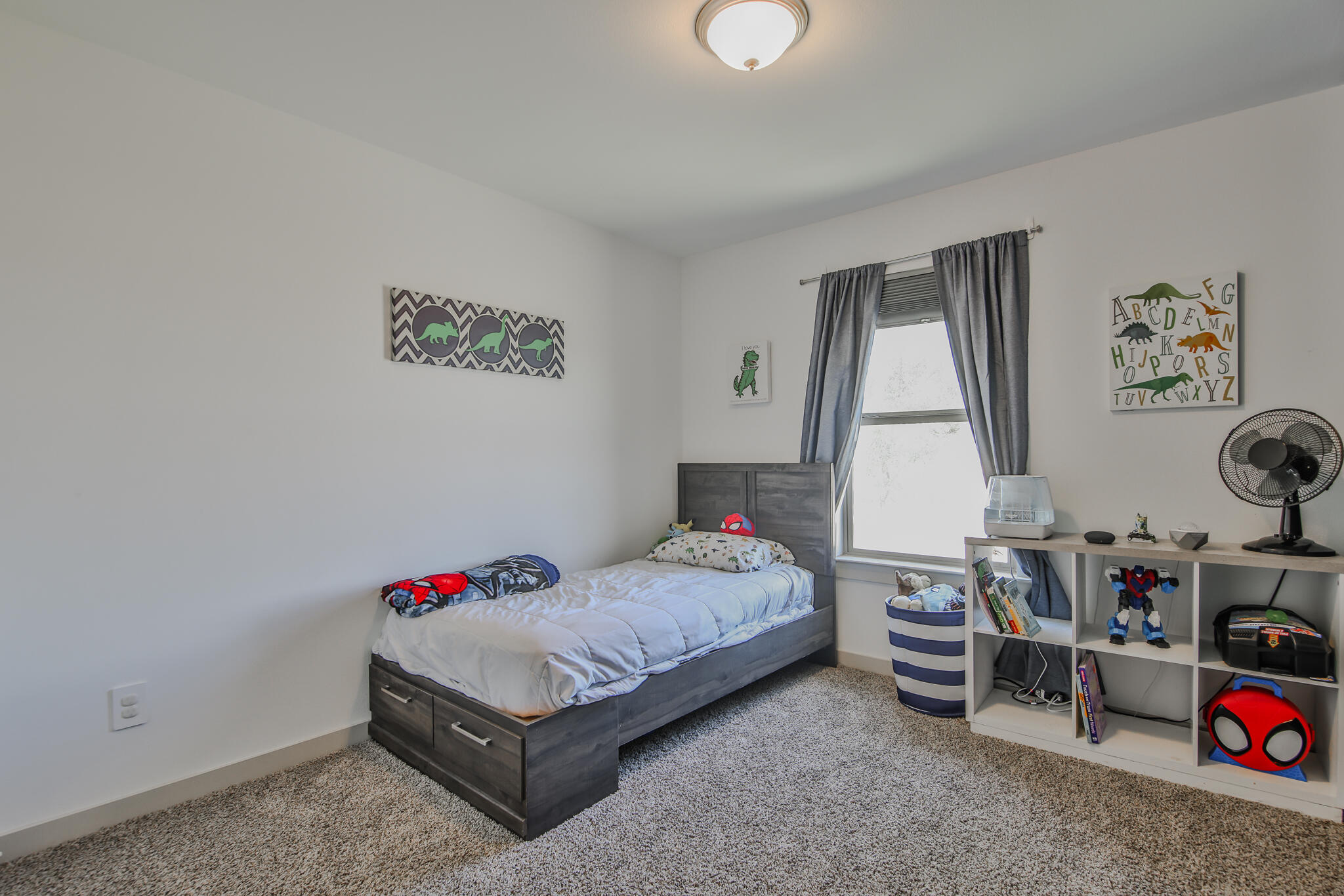 7406 9th Street Lubbock, TX 79416 - Photo 4 of 54 a bedroom with a bed and a window