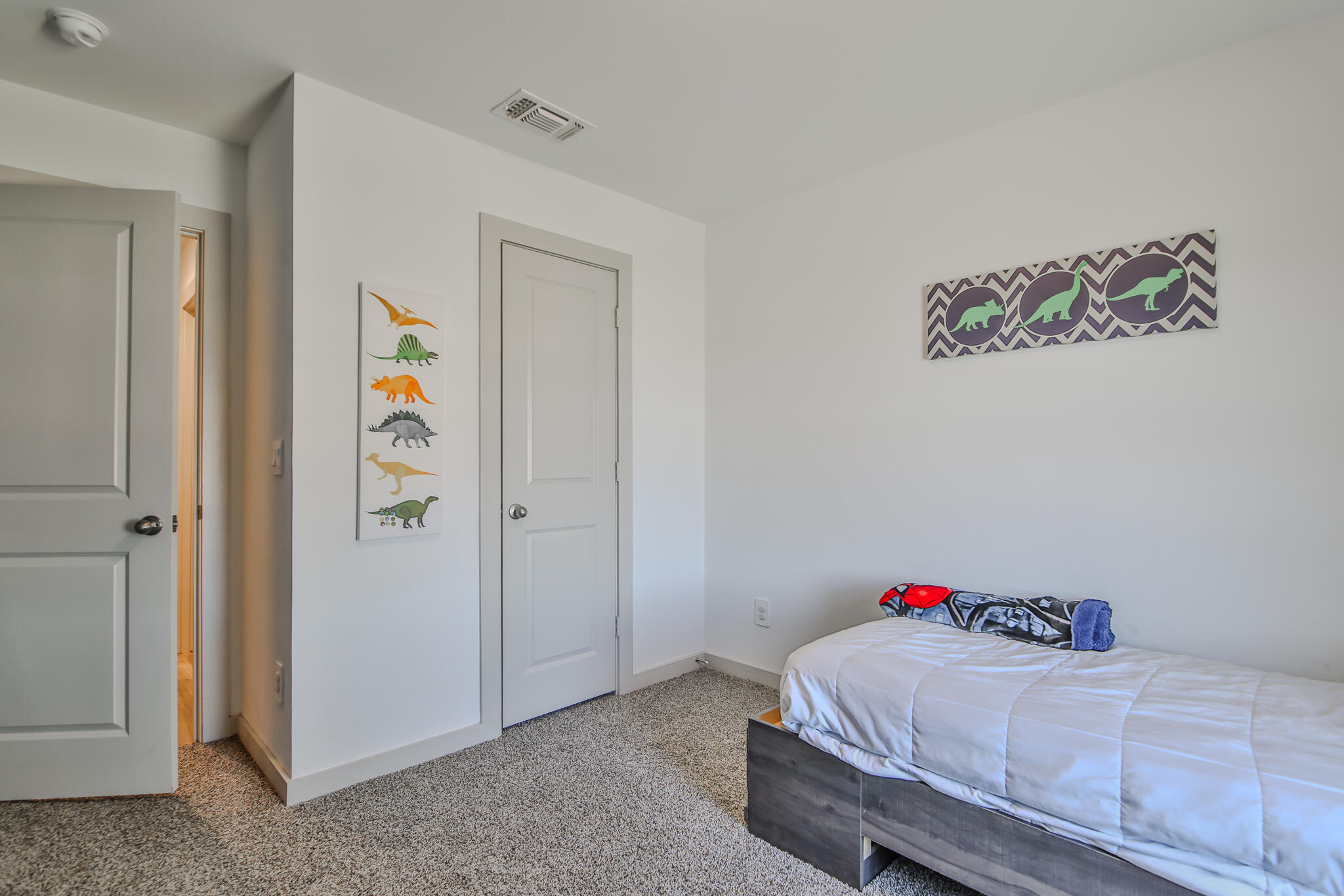 7406 9th Street Lubbock, TX 79416 - Photo 5 of 54 a bedroom with a bed and a window