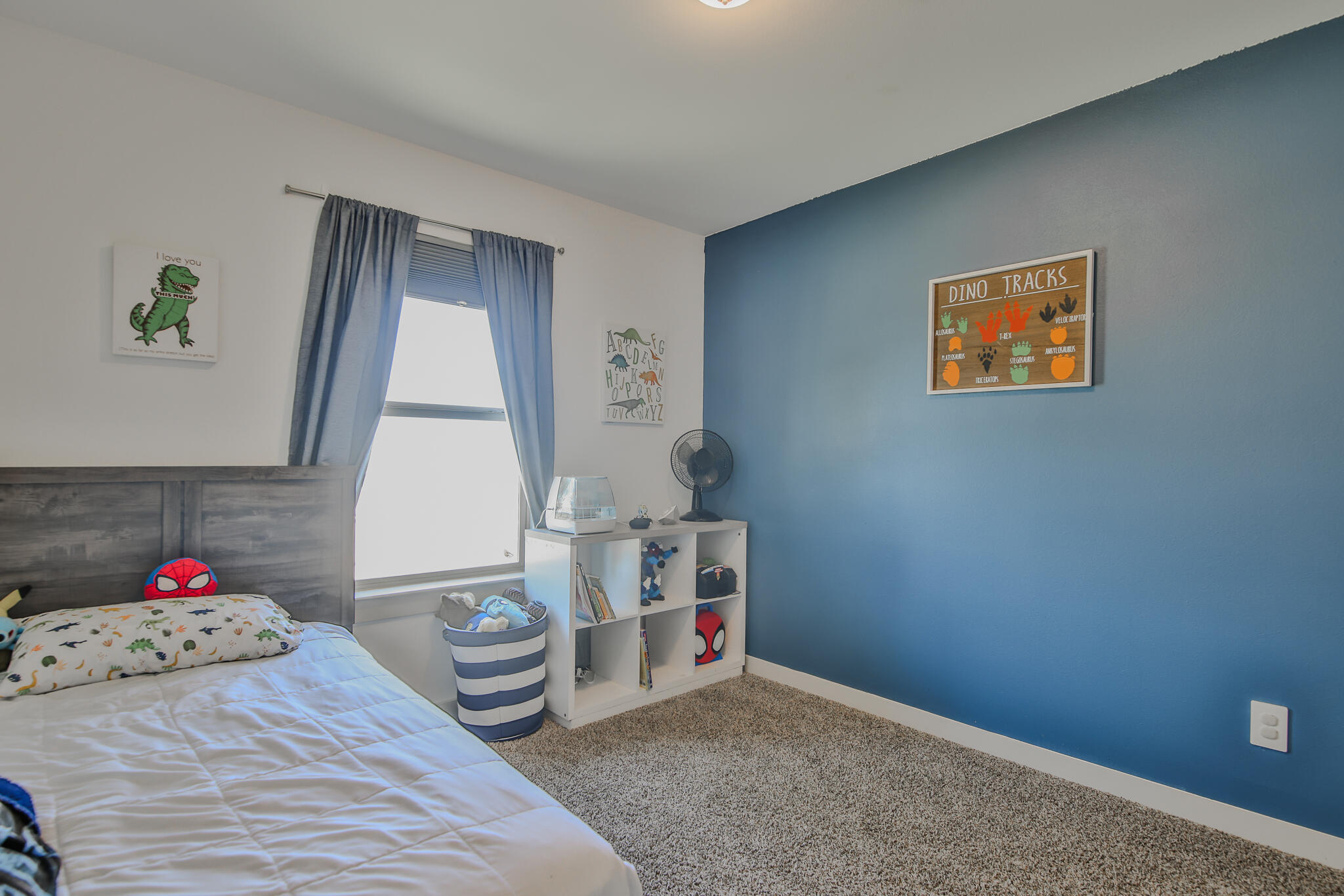 7406 9th Street Lubbock, TX 79416 - Photo 6 of 54 a room with a bed and a window