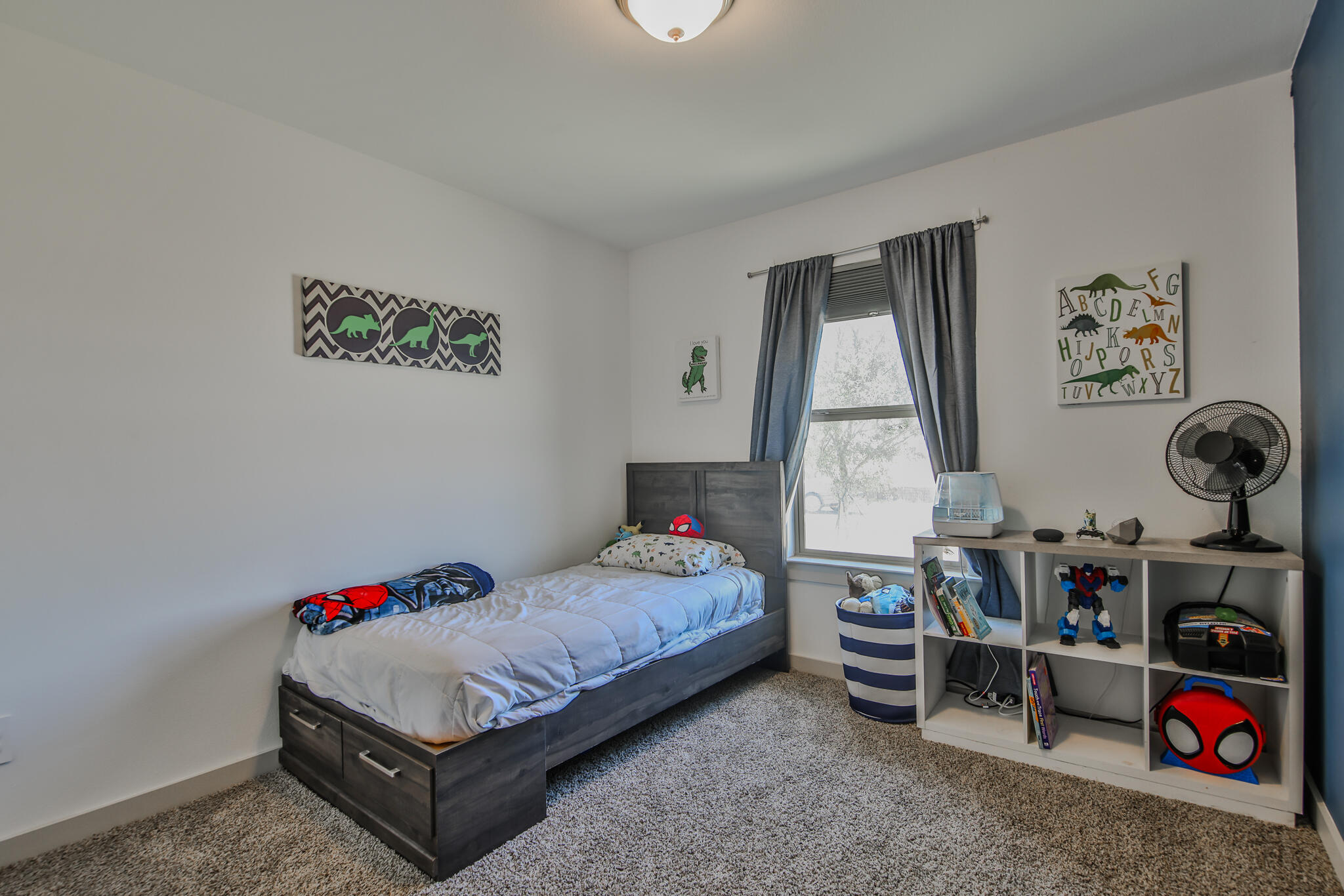 7406 9th Street Lubbock, TX 79416 - Photo 7 of 54 a room with toys and a window