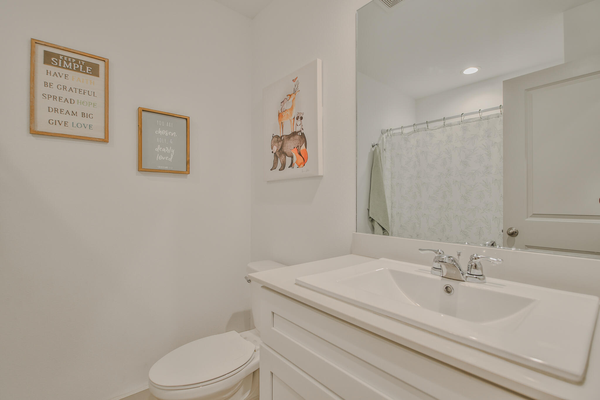 7406 9th Street Lubbock, TX 79416 - Photo 9 of 54 a bathroom with a sink toilet and vanity