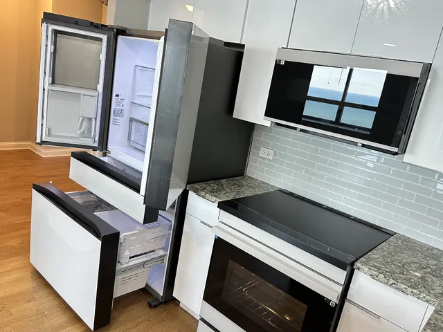 a stove top oven sitting inside of a kitchen