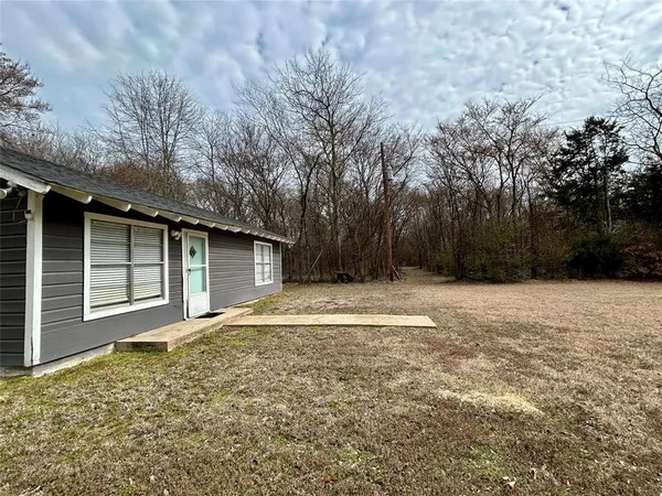 a house with trees in front of it