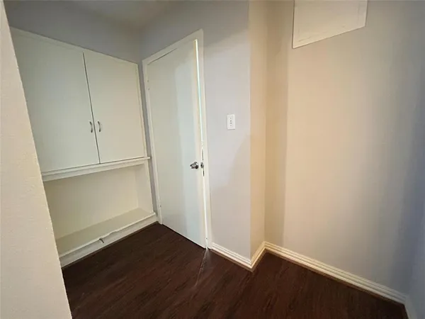 an empty room with wooden floor