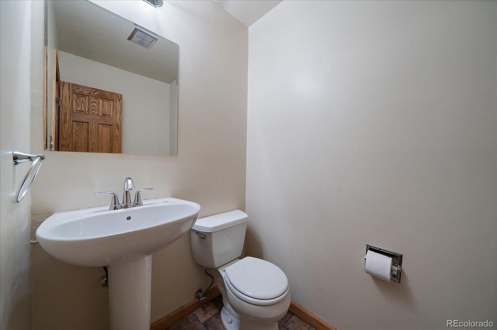 2510 South Cherry Street Denver, CO 80222 - Photo 17 of 37 a white toilet sitting next to a bathroom sink
