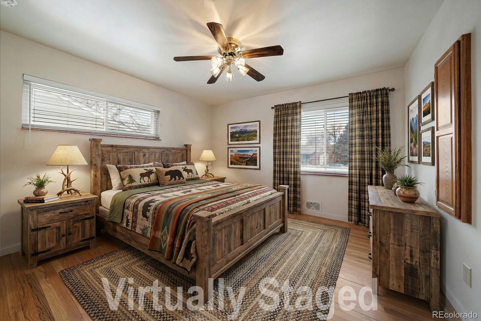 2510 South Cherry Street Denver, CO 80222 - Photo 19 of 37 a bedroom with a large bed and a chandelier