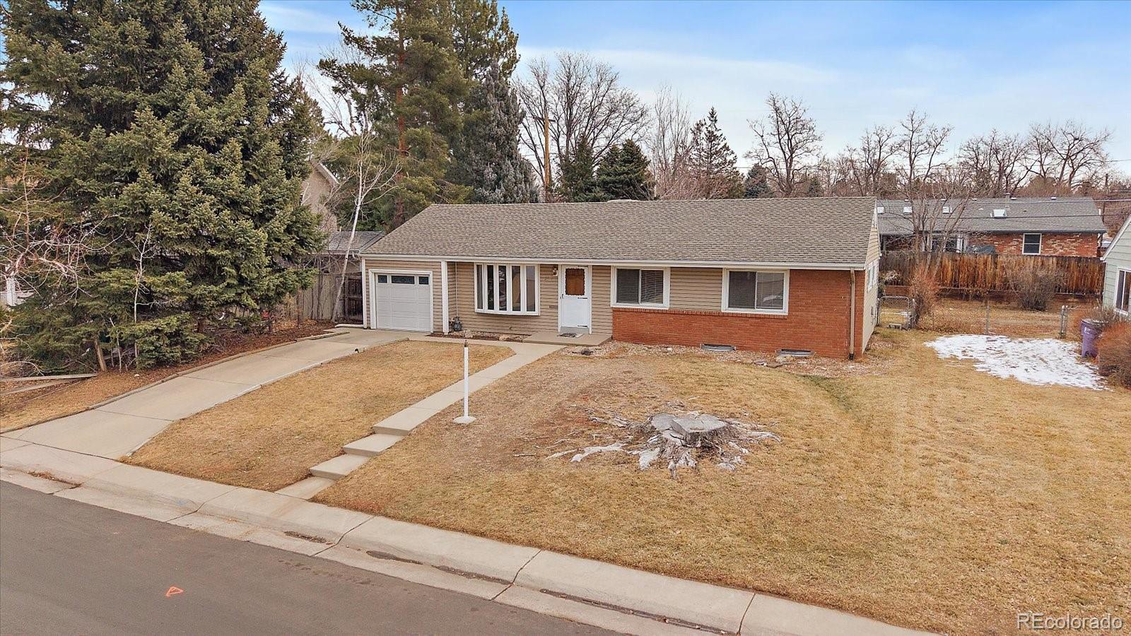 2510 South Cherry Street Denver, CO 80222 - Photo 3 of 37 front view of house with a yard
