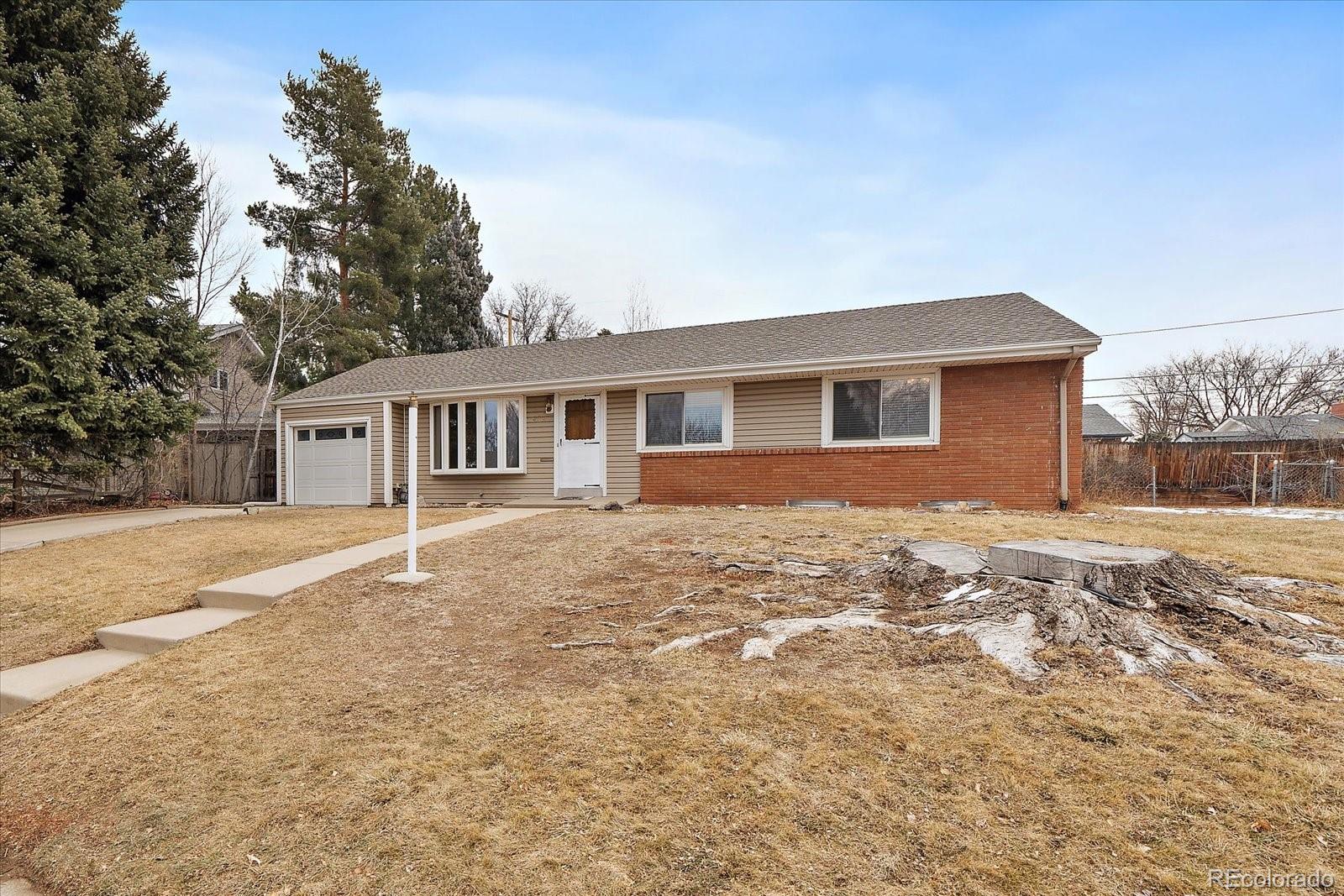 2510 South Cherry Street Denver, CO 80222 - Photo 5 of 37 a view of a house with a yard