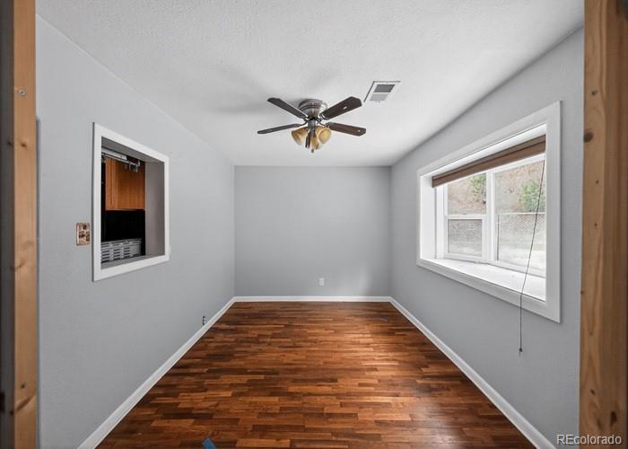 6498 South Turkey Creek Road Morrison, CO 80465 - Photo 12 of 19 a view of an empty room with a window